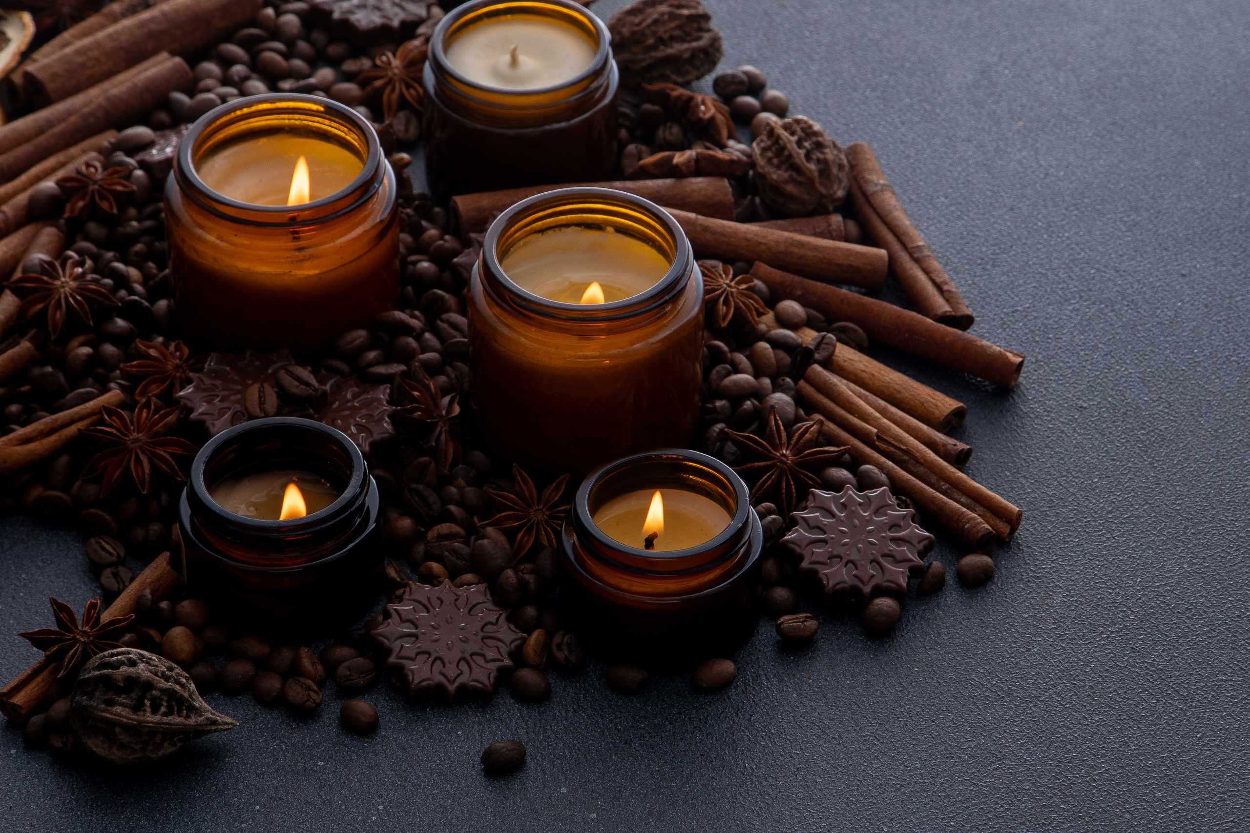 Aromatic still life with candles coffee and cinnamon